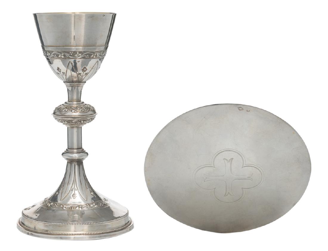 A French Gothic revival silver chalice with paten,: A French Gothic revival silver chalice with paten, 925/000, maker's mark 'Demarquet freres', the inside of the chalice as well as the paten gilt decorated, H 23,5 cm - Weight: about 394g