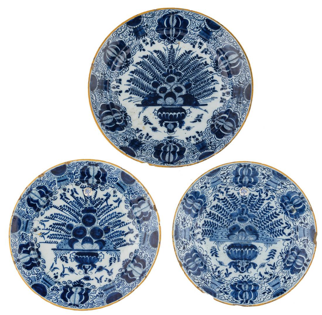 Three blue and white Delftware plates with a so called (1 of 5)