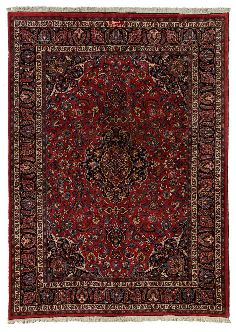 An Oriental floral decorated woollen rug with central (1 of 3)