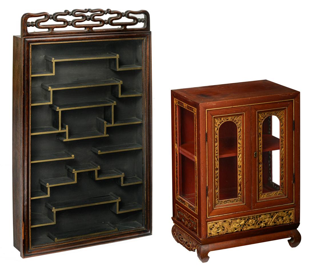 A Chinese richly carved gilt decorated elmwood display: A Chinese richly carved gilt decorated elmwood display cabinet, on a ditto matching base; added a ditto hardwood display wall cabinet; the gilt cabinet H 61 (with base) - W 44 - D 27 - the wall cabine