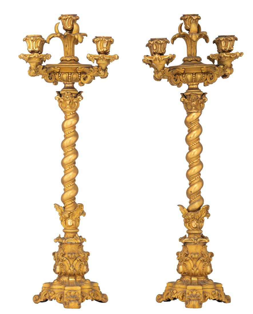 A pair of Napoleon III ormolu bronze Solomonic column: A pair of Napoleon III ormolu bronze Solomonic column candelabras, the second half of the 19thC, H 66 cm