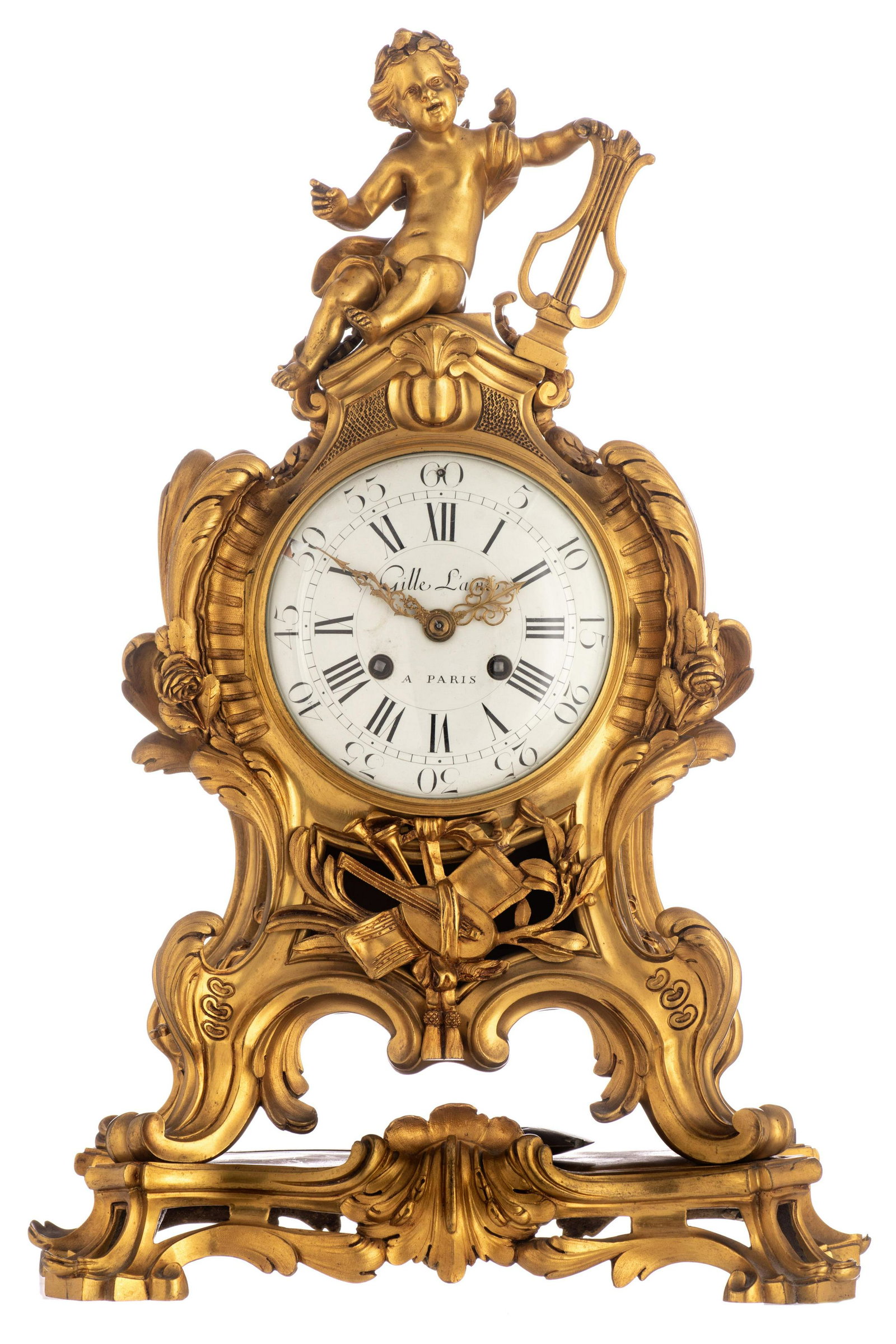 A Rococo Revival ormolu bronze cartel clock, decorated: A Rococo Revival ormolu bronze cartel clock, decorated with a trophy and a putto holding a lyre on top, the dial marked 'Gille l'aÃ®ne a Paris', the inside marked 'JLF' and 'Medaille de Bronze J. Ma