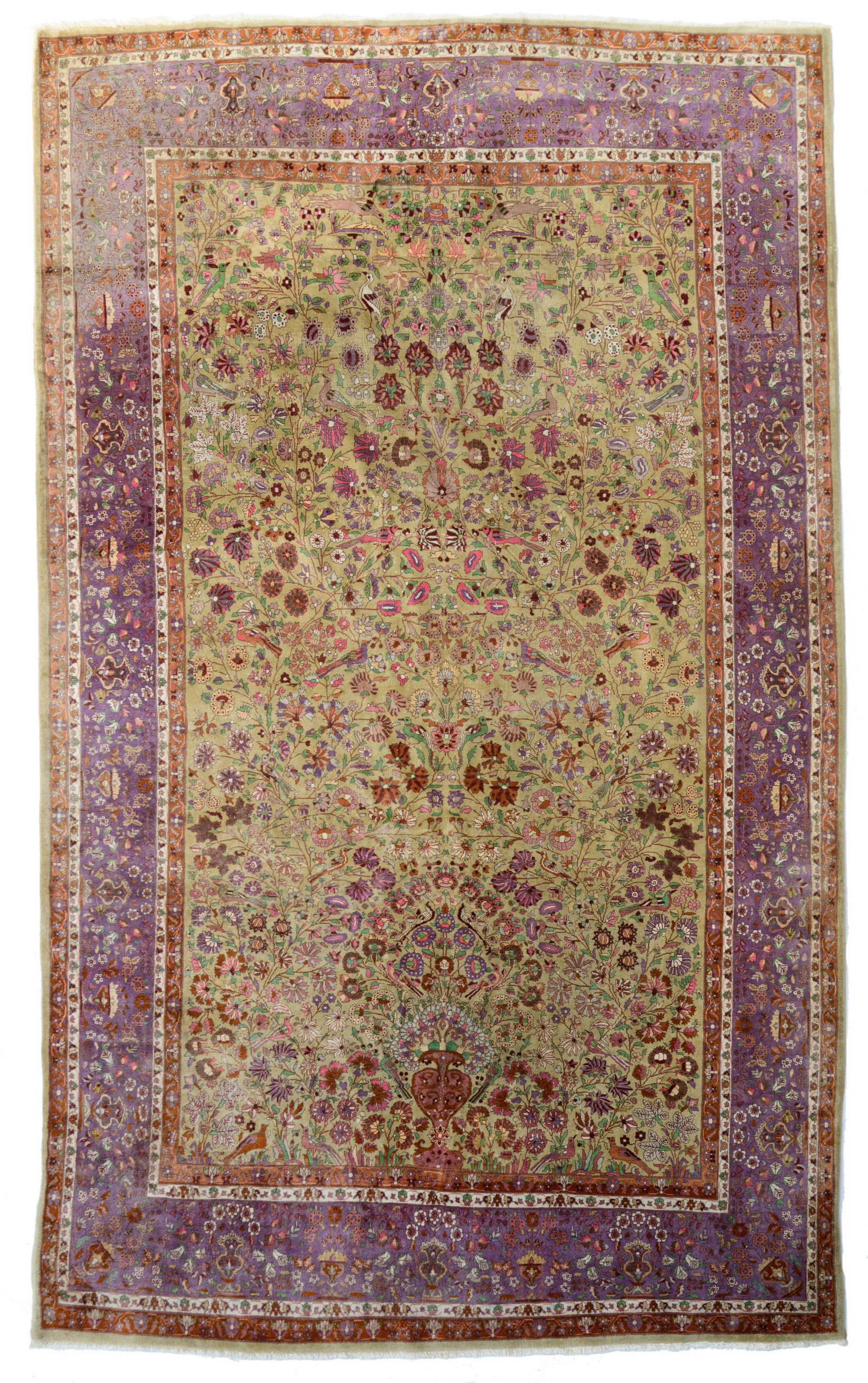 An Oriental rug, decorated with a flower vase and birds: An Oriental rug, decorated with a flower vase and birds on flower branches, 223 x 362 cm