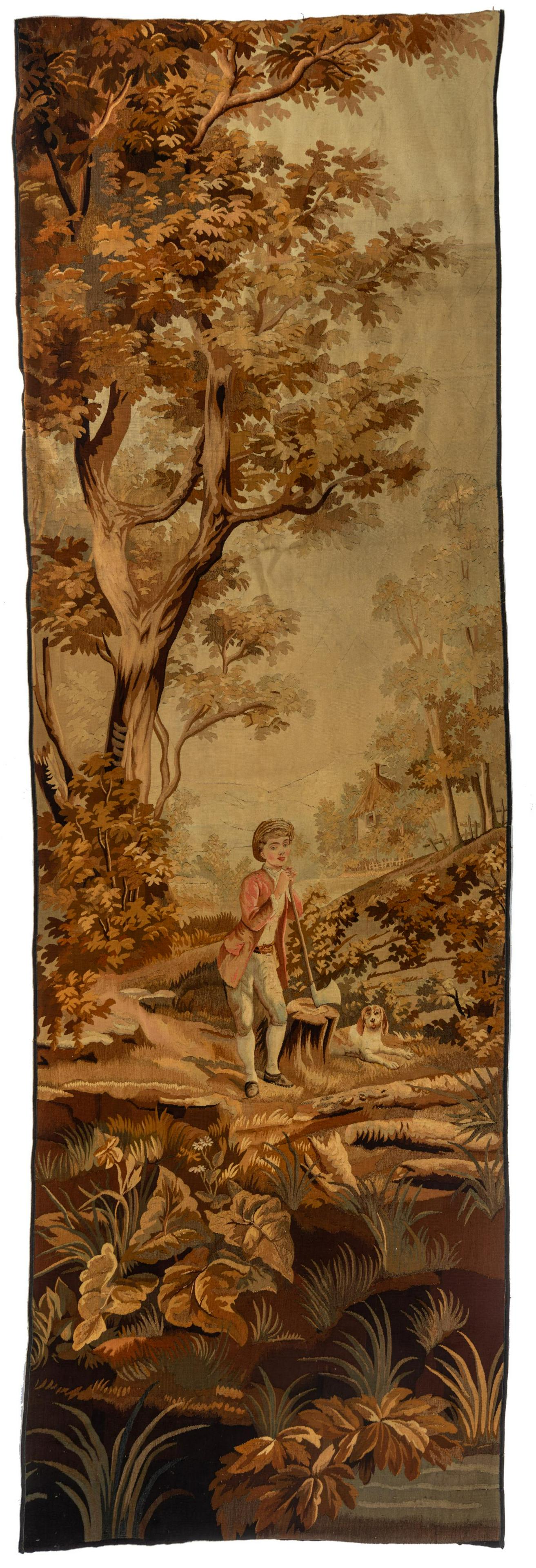 An Aubusson type tapestry, decorated with a lumberjack: An Aubusson type tapestry, decorated with a lumberjack scene, 19thC, 125 x 405 cm