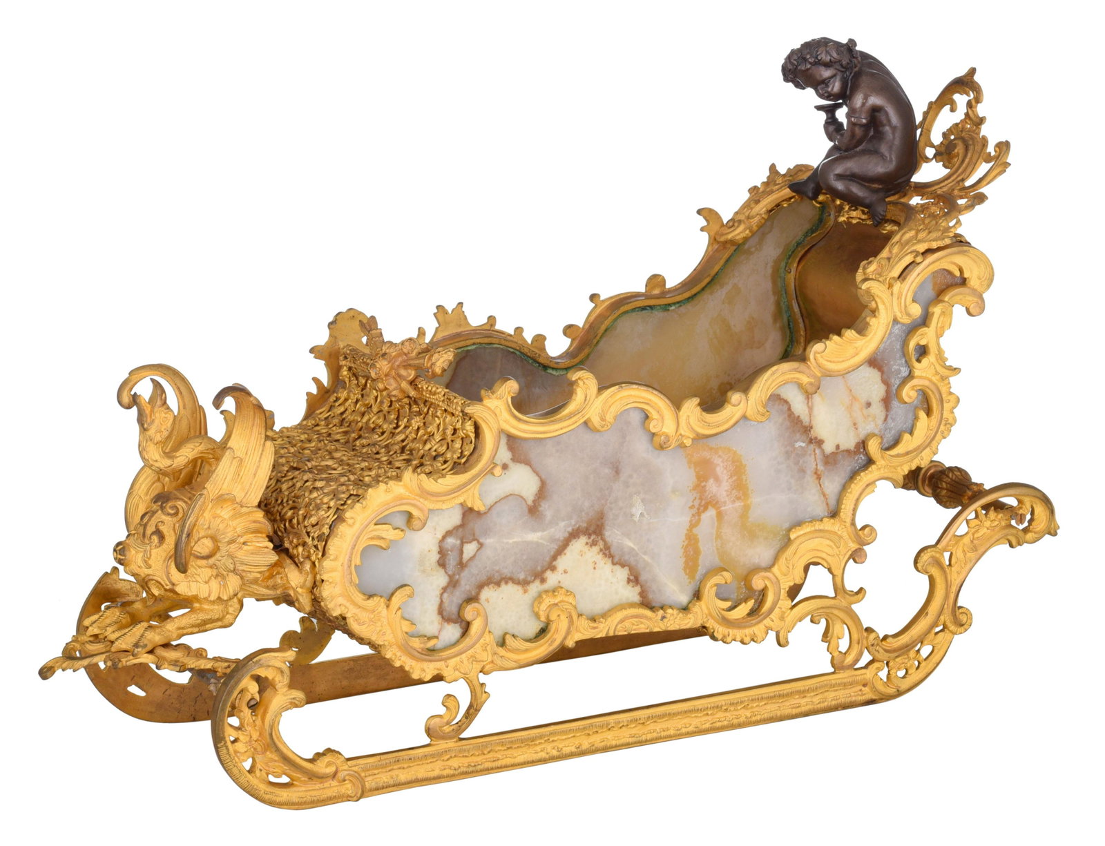 A fine gilt and patinated bronze Russian Rococo style: A fine gilt and patinated bronze Russian Rococo style miniature sledge, with onyx plaques, H 31 - W 50 cm On top of the sledge sits a patinated bronze putto, on the front is a swan mounted.