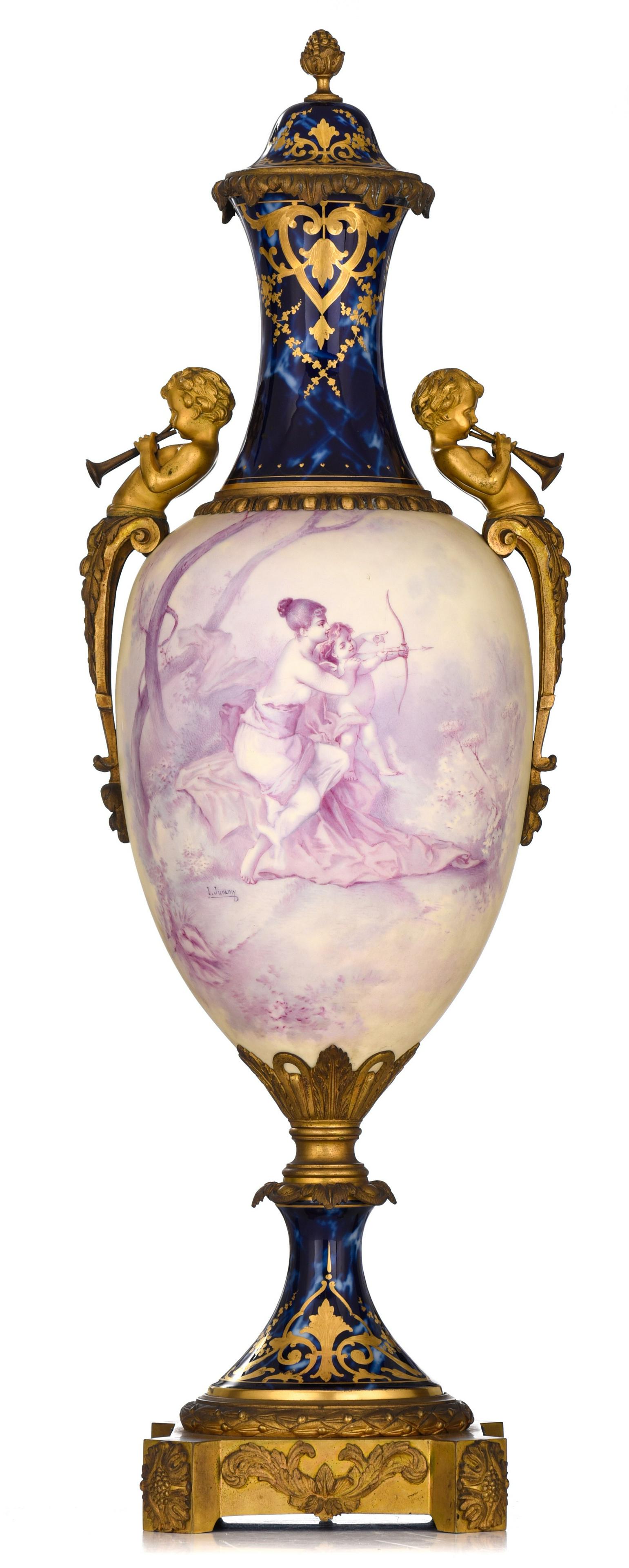 A fine Sevres vase, with Cupid and Aphrodite, signed: A fine Sevres vase, with Cupid and Aphrodite, signed and marked, H 81 cm 'Blue Royale' ground porcelain with gilt decoration and gilt bronze mounts of trumpet blowing putti. The central decoration wit
