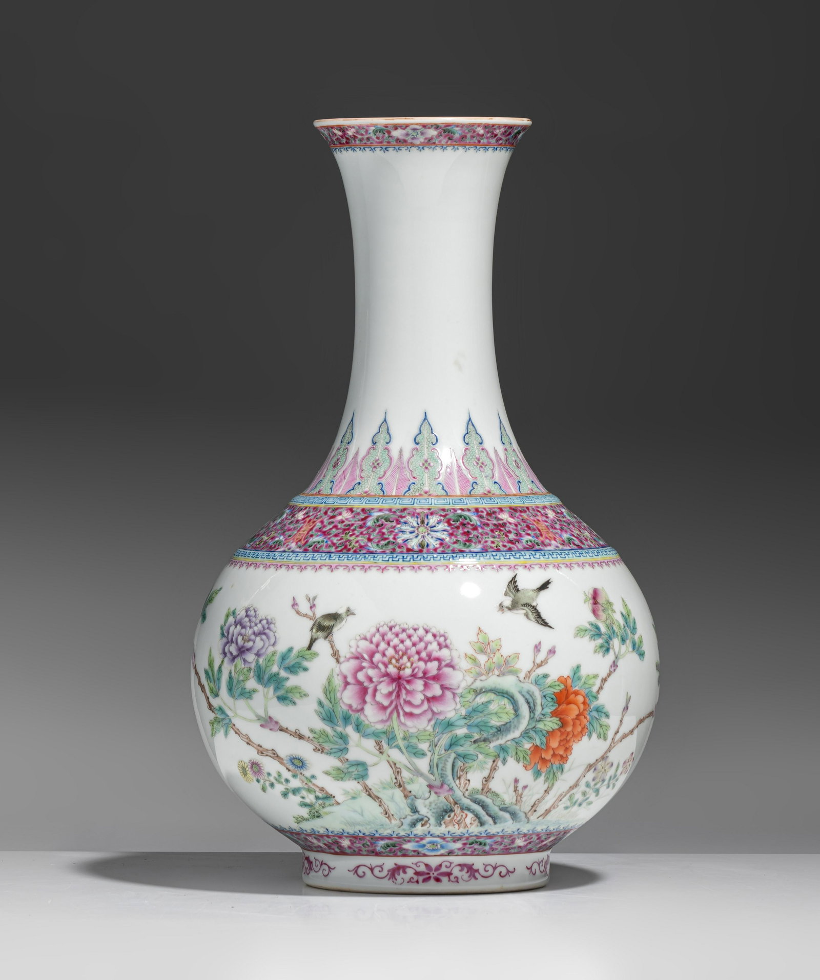 A fine Chinese famille rose 'Birds and Flowers' bottle vase, with a Qianlong mark, Republic period, (1 of 9)