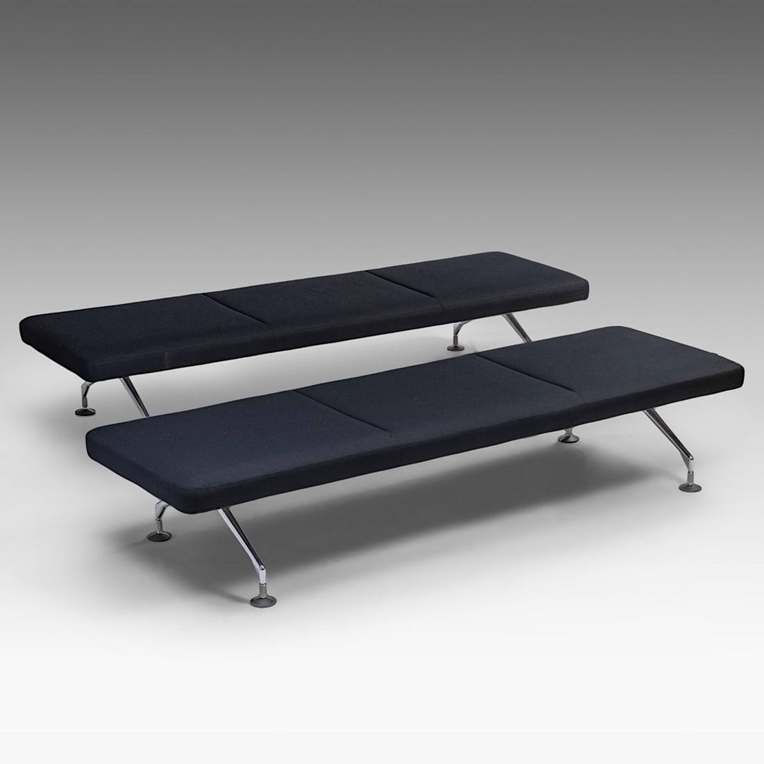 A pair of Antonio Citterio daybeds for Vitra, H 42 - W 222 - D 68 cm: A pair of Antonio Citterio daybeds for Vitra, H 42 - W 222 - D 68 cmUpholstered in black fabric on a chrome base.