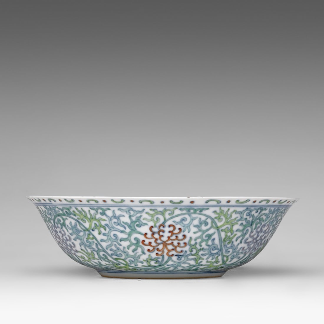 A Chinese doucai 'Scrolling Chrysanthemum' deep plate, Guangxu mark and of the period, dia 23 cm (1 of 7)