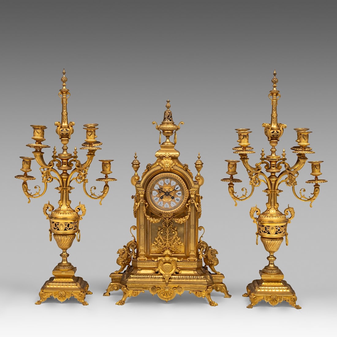 A Napoleon III gilt bronze three-piece mantle clock set, H 70 - 80 cm (1 of 5)
