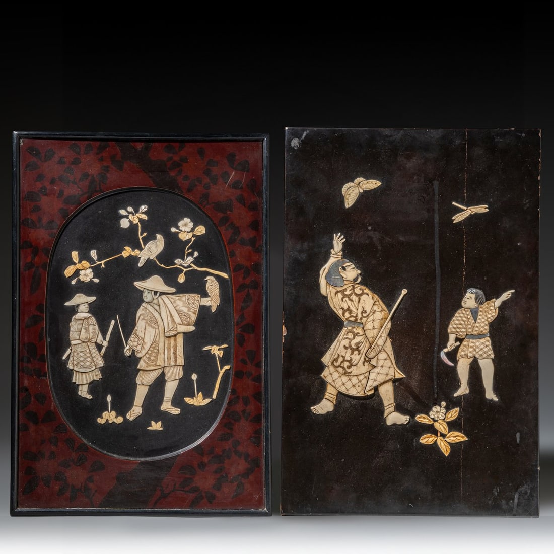 Two lacquer panels with Shibayama inlay, Meiji period (1868-1912), both 47x32 cm / 46x30 cm: Two lacquer panels with Shibayama inlay, Meiji period (1868-1912), both 47x32 cm / 46x30 cmInlaid with bone and mother of pearl, both depicting men with their sons, one with the inlay inside an oval-s