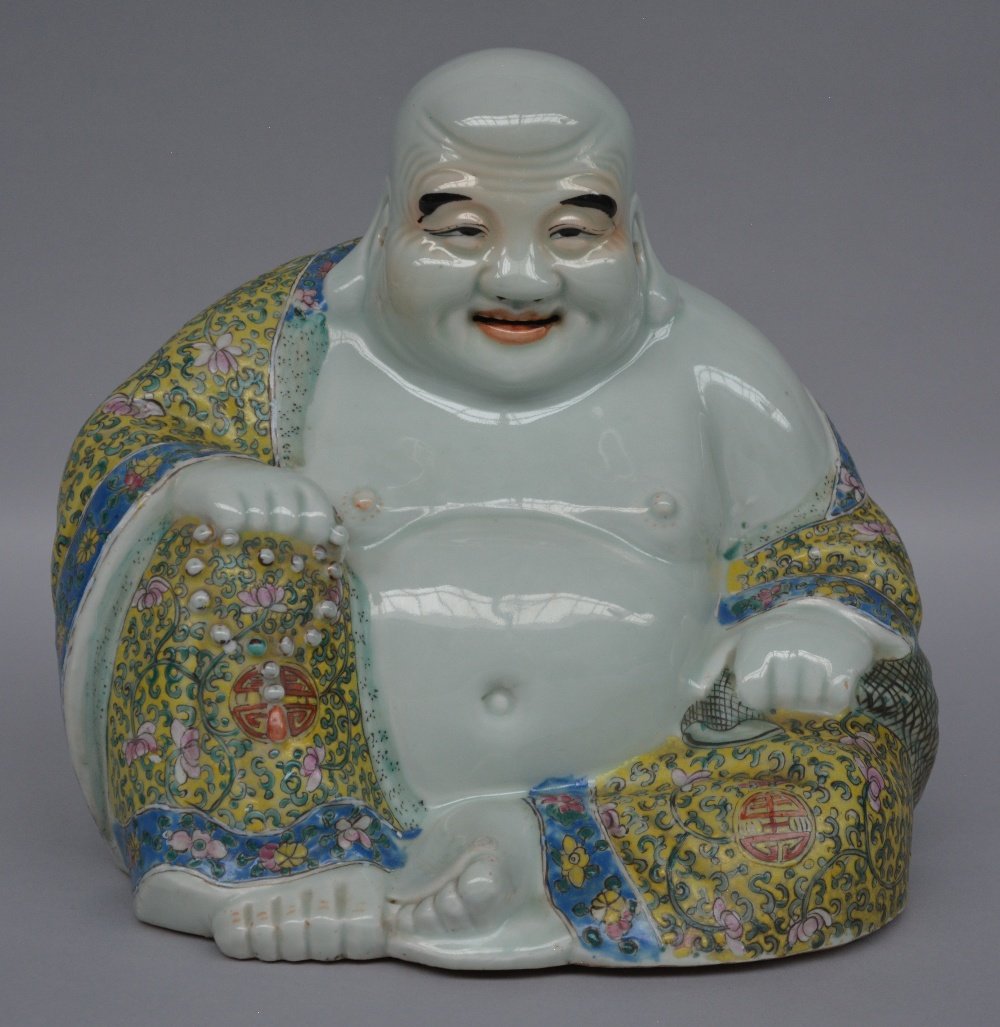 A Chinese polychrome seated laughing Buddha, marked, (1 of 7)