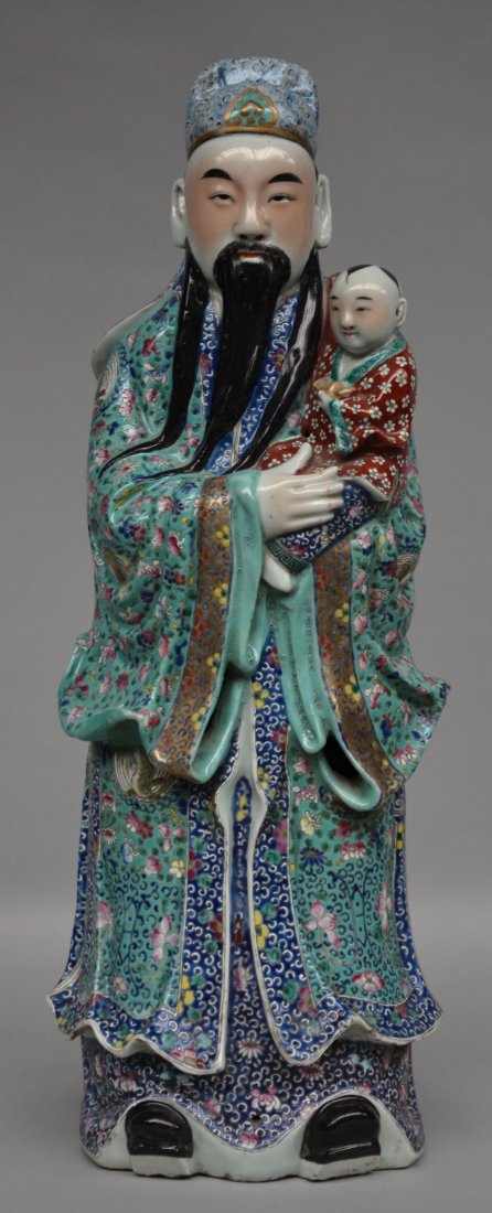 A Chinese polychrome Old wise man with a child, marked, (1 of 1)