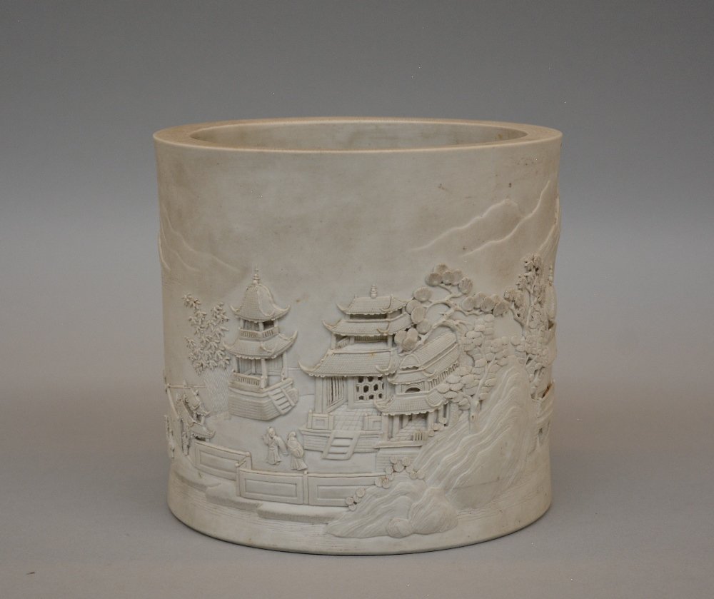 A Chinese biscuit porcelain brush pot decorated with a (1 of 9)