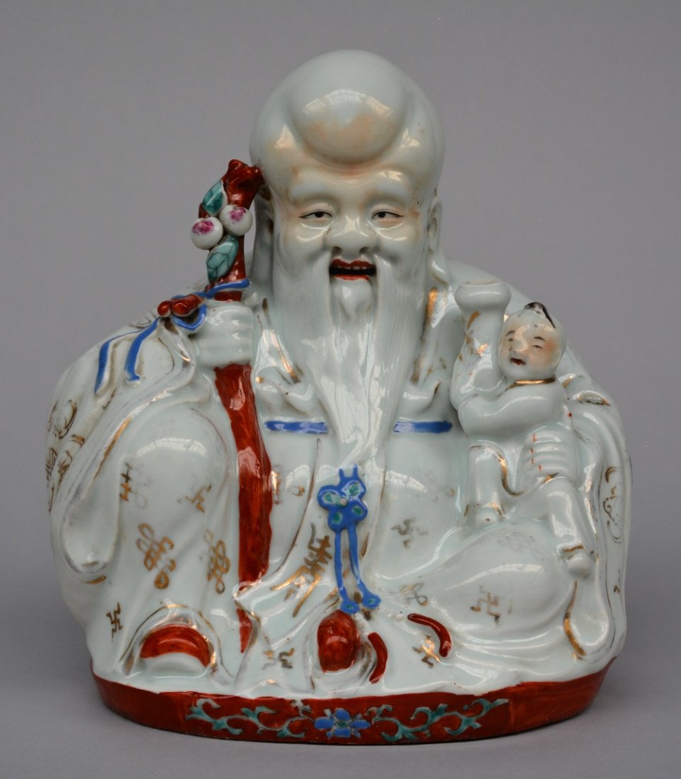 A Chinese incense burner, polychrome decorated,: A Chinese incense burner, polychrome decorated, depicting a Budai with child, marked, ca. 1900, H 26,5 cm
