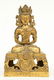 A Chinese gilt and polychrome decorated Buddha,