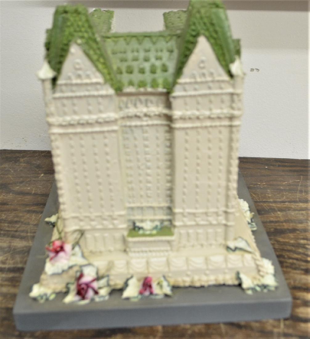 Plaza Hotel 75th Anniversary Building Model 1982: Miniature of The Plaza Hotel from it's 75th Anniversary. Made to look like a cake, it is 9" height x 8" width on a wood base. In good condition with slight wear. Signed and numbered 31 of 50 September