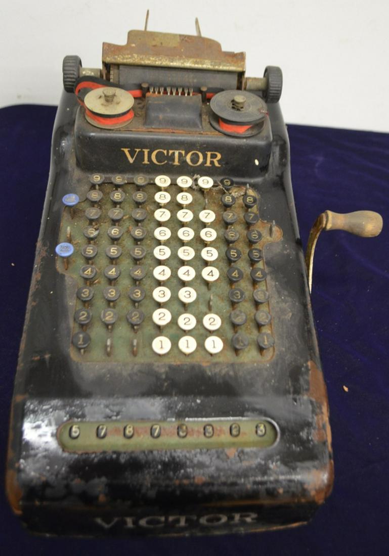 Antique Victor Adding Machine: cira 19-teens - 1920s. approx. 18" length. Expected wear and patina. Needs ribbon. Lever and buttons are smoothly operable.