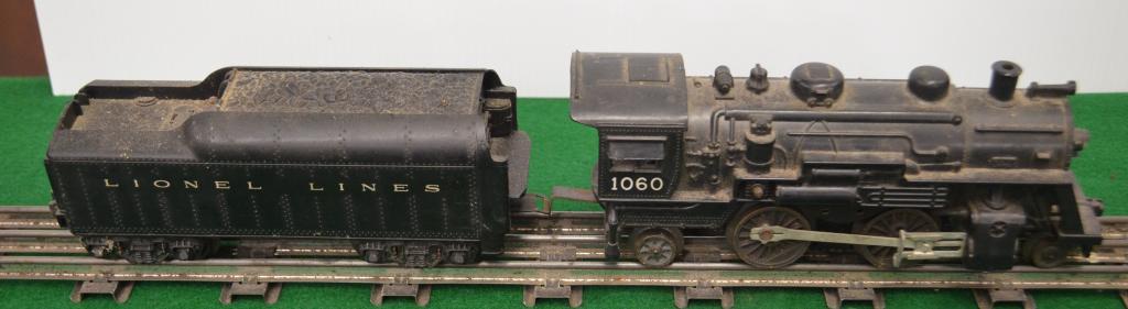 Lionel Steam Engine 1060 Locomotive: Lionel Pre-war Steam Engine No. 1060 Engine and Tender. O Gauge. Included in this lot are three freight trains pictured.