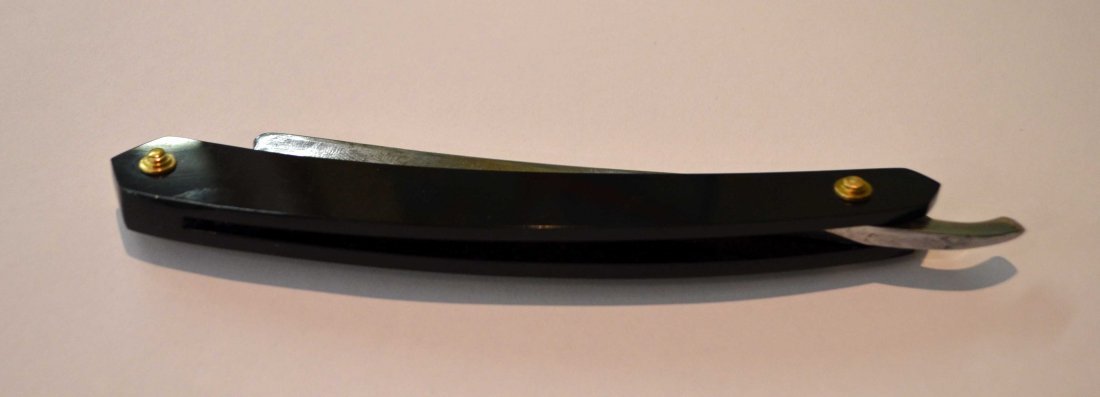 Vintage Wade & Butcher Barbers Razor: Wade & Butcher 13/16 Wedge. Barber's Notch.New Scales, washers. Solid brass beehive collars.Some staining, pitting but none on the edge or tang.