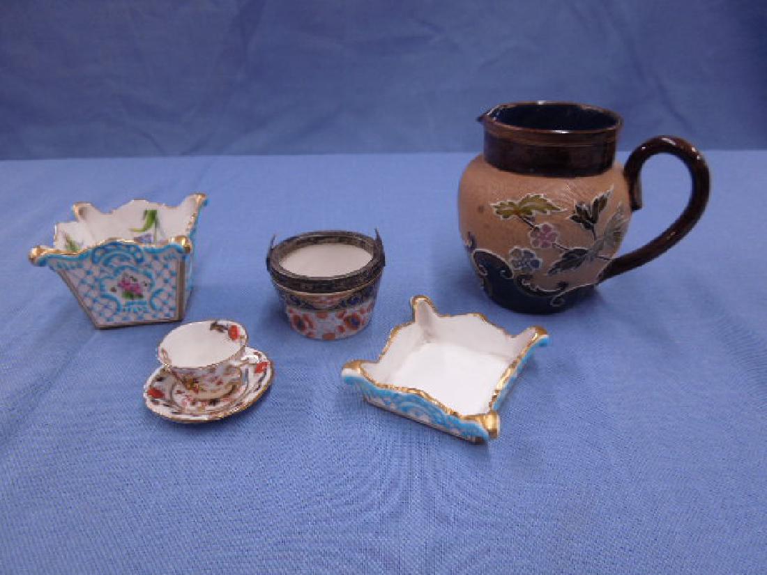 English Pottery & Porcelain Lot: Early 20th c. English pottery and porcelain lot includes: Doulton Lambeth "Doulton Slater's Patent" signed 3 1/2" (h) floral tapestry design cream pitcher, Mintons "R. Briggs & Boston" signed 1 3/4" (