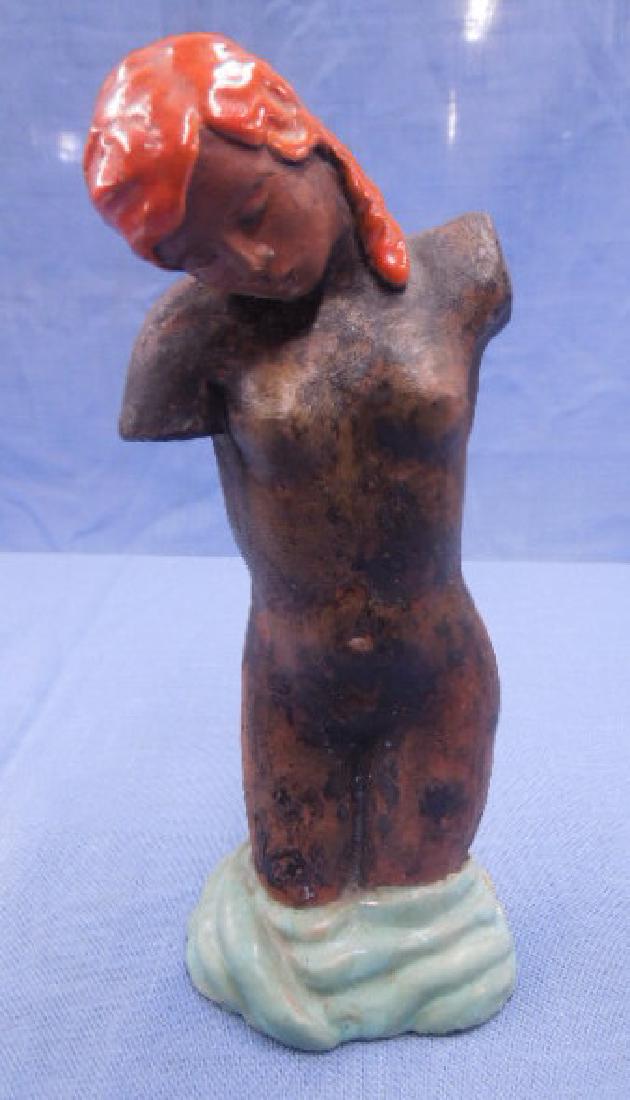 Austrian Pottery Female Torso Figure: Circa 1930's-1940's signed (circle with triangle) hand glazed Austrian redware pottery 8" (h) x 3 1/2" (l) female nude torso figure. CONDITION: Old repair on base.