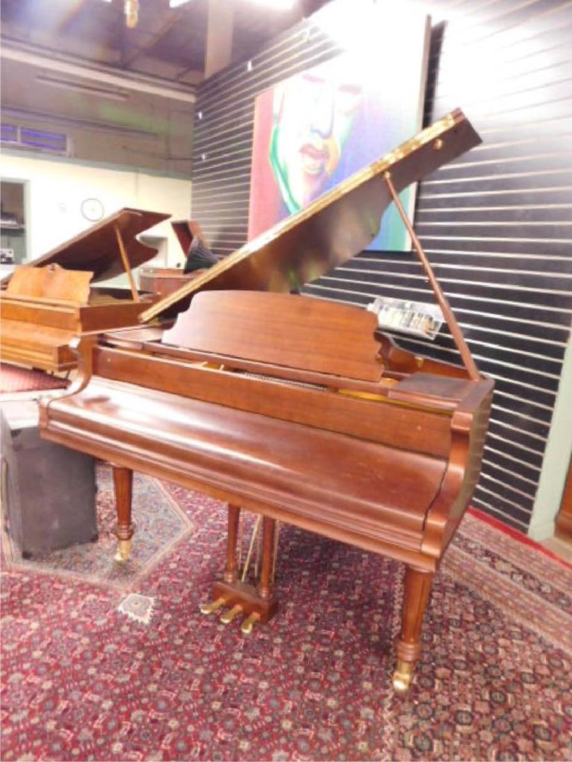 Pearl River Mahogany Baby Grand Piano: Pearl River Baby Grand piano, mahogany, model #GP142PI, serial #968113, features turned & reeded legs on heavy brass caps & casters, approx 55" length, late 20th c. CONDITION: Excellent.