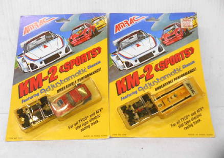 AMRAC KM-2 Sports Slot Cars: Two vintage AMRAC KM-2 Sports slot cars includes: AMRAC #9 Sachs Bosch Indy F-1 racer & BAP GEON Datsun 240Z. CONDITION: Both are still sealed in their packaging. Datsun is in very good condition. Lab