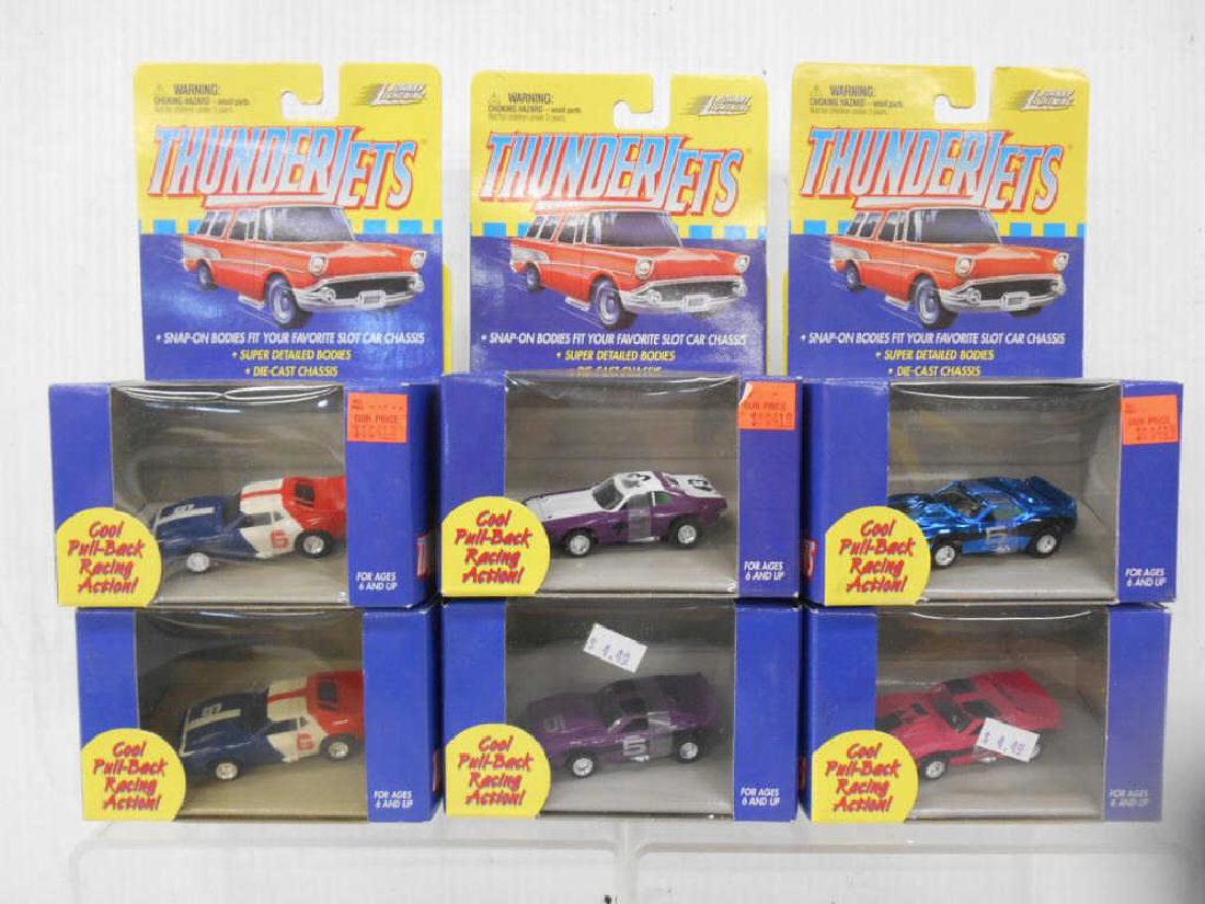 Johnny Lighting Thunderjets Slot Cars: Six assorted Playing Mantis Johnny Lighting Thunderjets Cool Pull-Back Racing Action slot cars. CONDITION: All are still sealed in their packaging & are in very good condition.