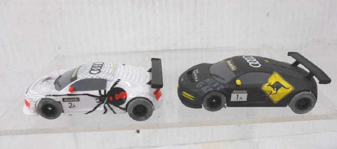 Scalextric Audi R8 GT3 Slot Cars: Hornby Hobbies Ltd. Scalextric Audi R8 GT3 LMS Armor All Phoenix Racing & Audi R8 GT3 LMS Kangaroo Phoenix Racing slot cars. CONDITION: Both are in untested very good condition with minor wear.