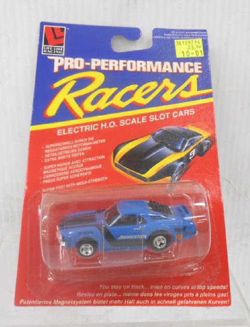 Life-Like European Release Mustang Slot Car: Life-Like Racing Pro-Performance Racers Electric H.O. Scale European release No. 9796 Ford Boss Mustang blue & black slot car. CONDITION: Still sealed in its original packaging and in very good condit