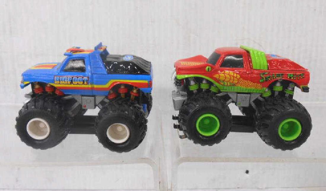 Marchon Bigfoot & Snake Bite Slot Cars: Marchon Inc. MR-1 Racing Ford Bigfoot & Ford Snake Bite monster truck slot cars. CONDITION: Both are in very good untested condition.