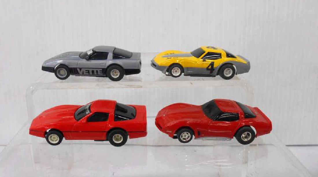Tyco AFX Corvette Slot Cars: Four assorted Tyco AFX Corvette slot cars. CONDITION; Untested fair condition with minor wear.