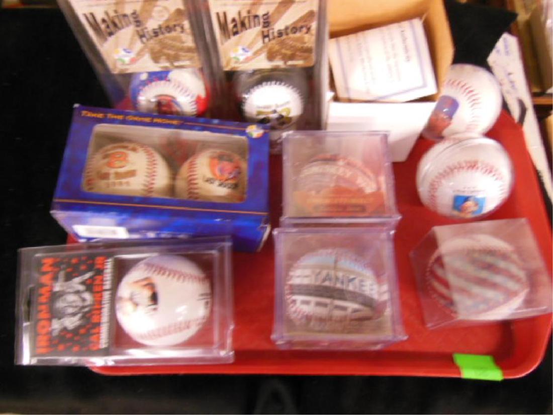 Lot of Foto + Other Baseballs: Lot of Foto and Other Baseballs, most in original packages including: Making History, M.McGwire and B. Bonds, Cal Ripken, Jr. single and double ball set, plus stadium balls, Yankee and Comiskey Park a