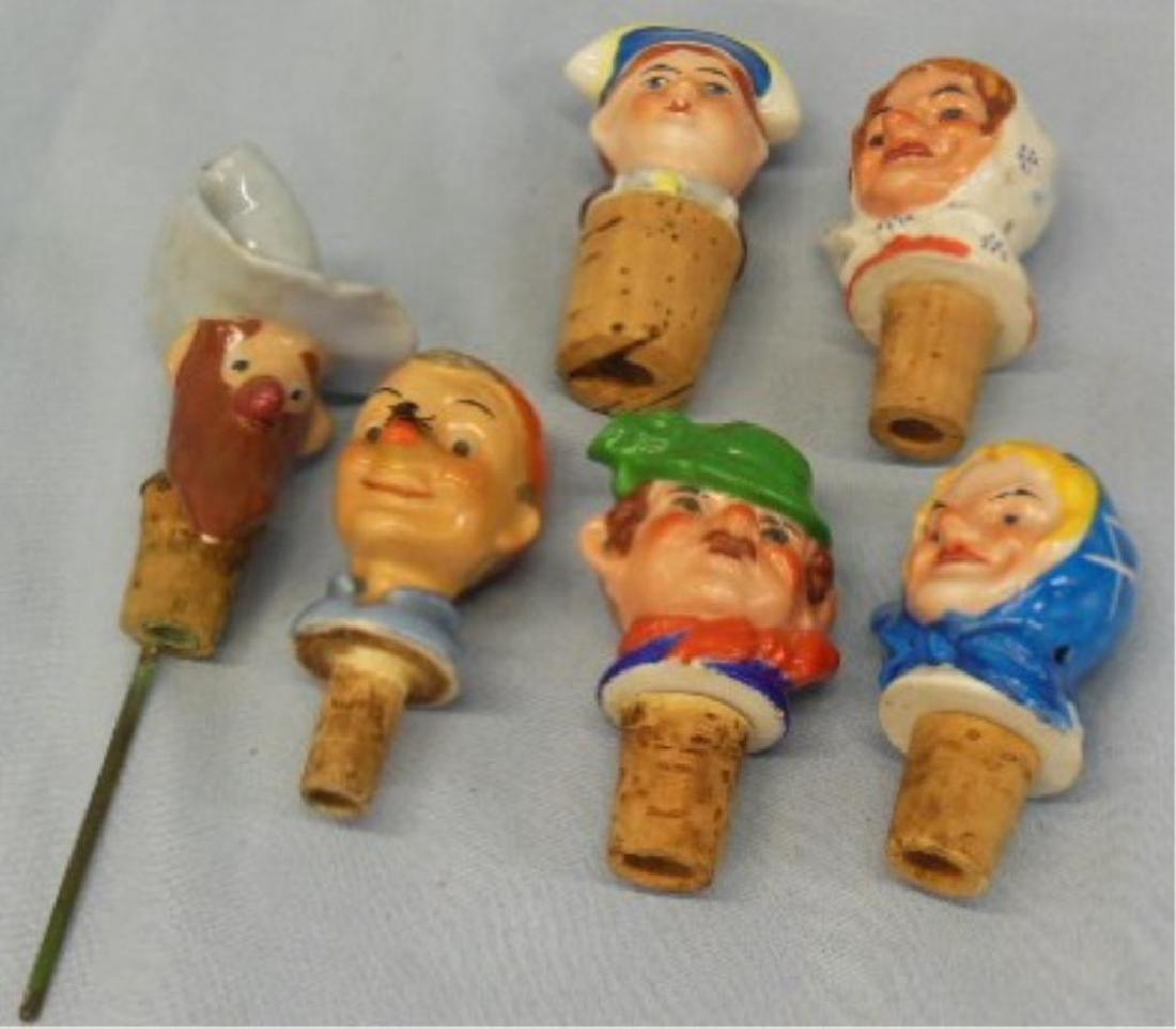 6 Porcelain Head (Pourer) Bottle Stoppers: 6 Porcelain Head (Pourer) Bottle Stoppers, all side pourers including: Mountain Man (with metal bottom extension, pours through hat), man with movable fly on nose, sailor, Irishman and (2) woman with 