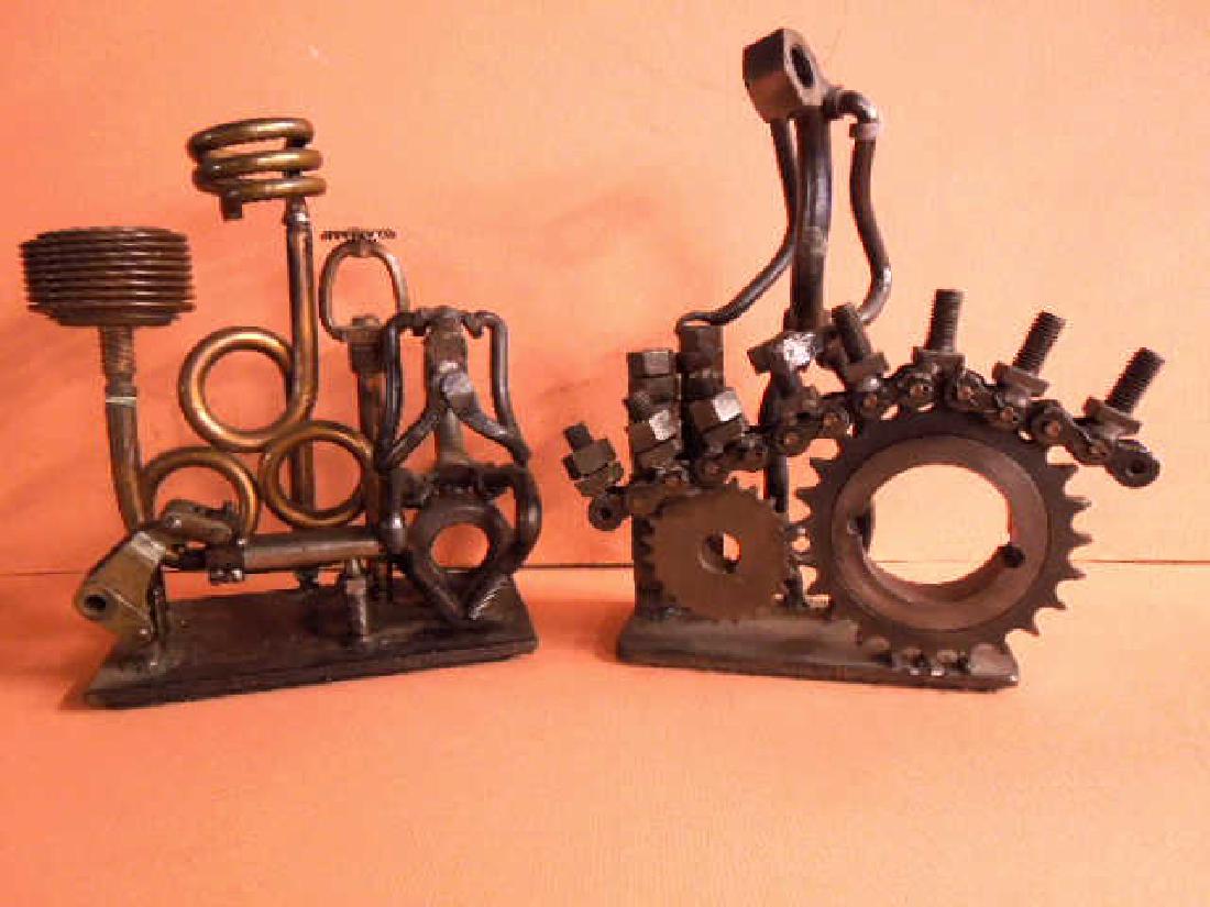 F. Russo Signed Industrial Sculptures: Lot of two F. Russo Signed Industrial Sculptures includes: 11 1/2" (h) x 7" (h) x 3" (w) figure of a standing man, made from nuts bolts and gears and 10" (h) x 8" (l) x 4 1/2"(w) figure of a seated ma