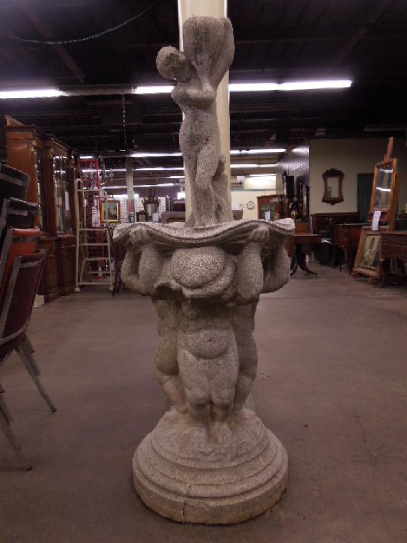 Cement Bird Bath w/Sculpture: Cement Bird Bath w/Sculpture, features, three standing putti holding a clam shell over their heads, a 30" standing female nude with urn sits in the shell, base 37 1/2"h, 25"d, figure 37" x 10" x 10". 