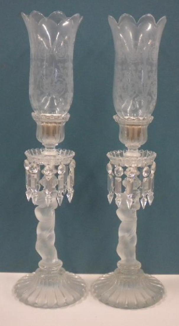 Pr Baccarat Cherub Hurricanes: Pr Baccarat Cherub Hurricanes, the frosted glass cherubs rest upon a fluted base, and are crested by scalloped edge and fluted candle holders and bobaches with cut spear prisms. Also includes the orig