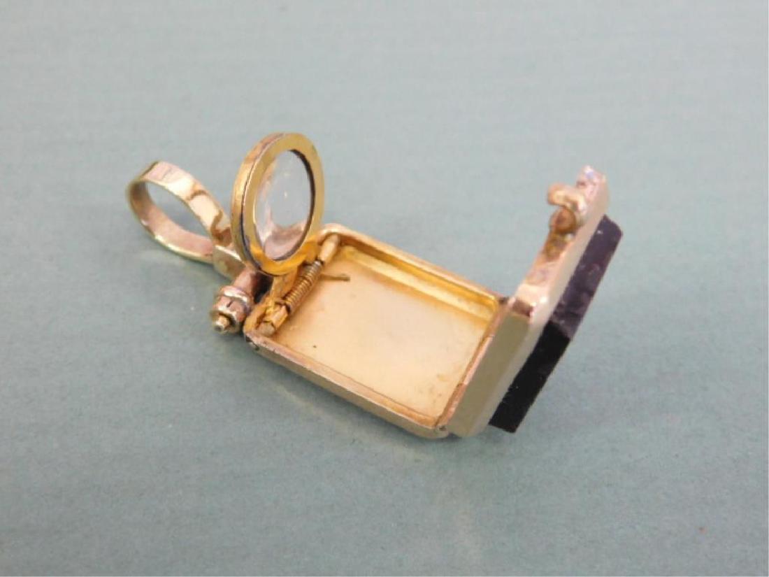 Rare Victorian Fob w/Magnifying Glass: Rare Victorian Fob w/Magnifying Glass, tests 10k, onyx male intaglio and monogram "H.B"[. Pop-up round magnifying glass when locket opens, hinged loop, 8.5 DWT. 1 3/4" l, 3/4" across. CONDITION: Very 
