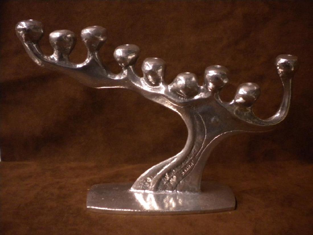 Don Drumm Aluminum Menorah: Don Drumm signed contemporary 20th C. cast and polished aluminum 10 1/2" (h) x 15" (l) tree branch Menorah. CONDITION: Very good condition with minor wear.