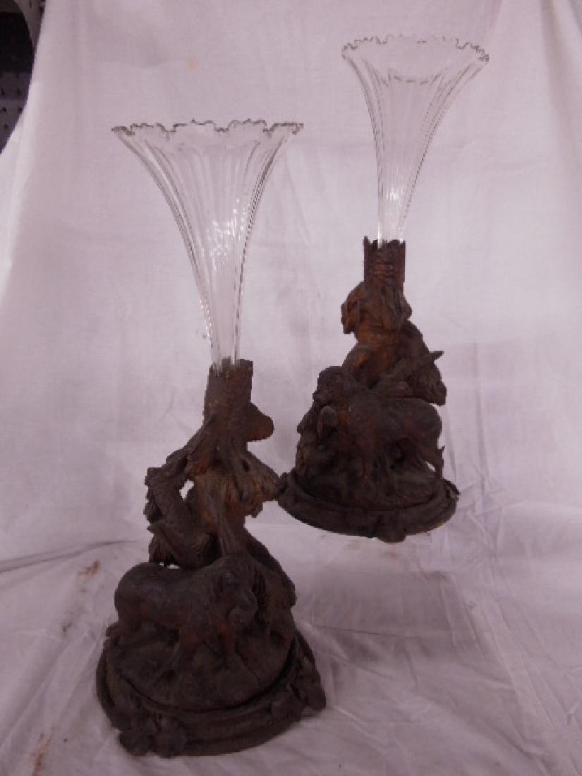 Pr Black Forest Dog Carved Epergnes: Pr Black Forest Dog Carved Epergnes, carved and stained walnut, each depicting a standing dog with collar keg in a forest setting with a clear crystal trumpet form scalloped top vase, late 19th C. 20'