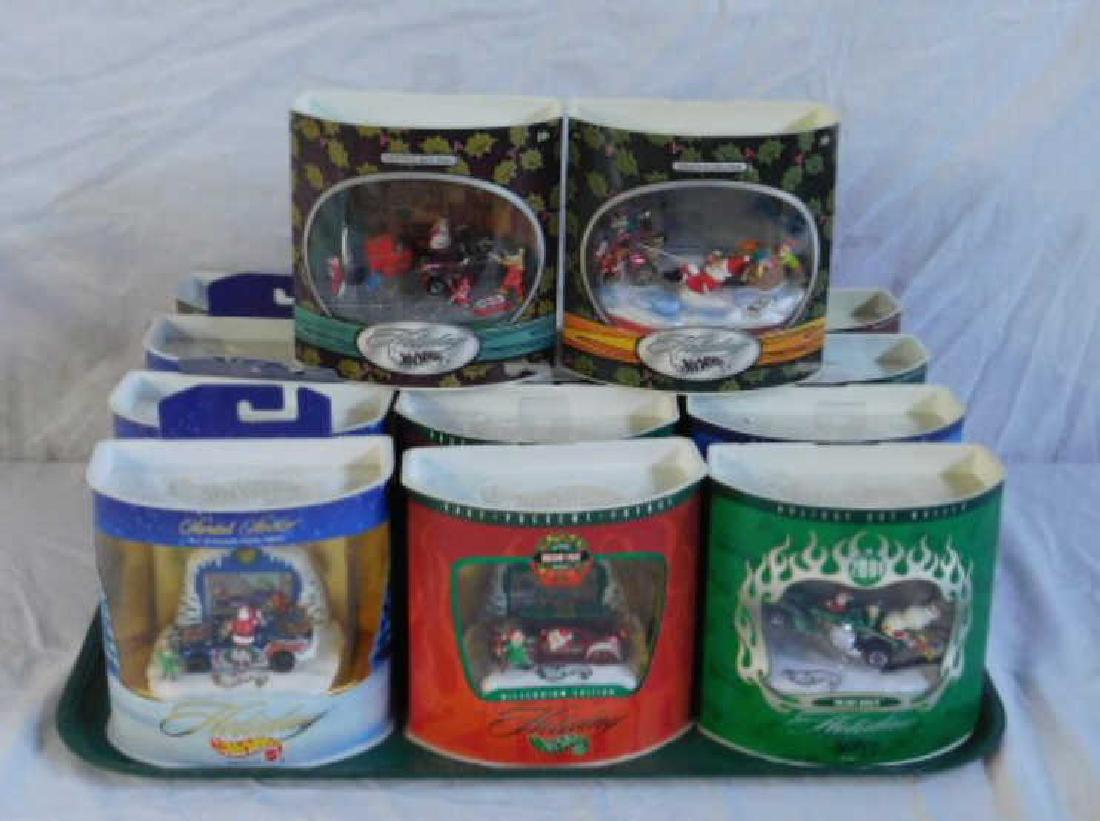 Holiday Hot Wheels Displays: Lot of 11 assorted 1998-2002 Mattel die-cast Holiday Hot Wheels displays, still sealed in their original packaging. CONDITION: Wear on packaging.