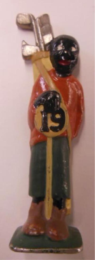 Vintage Black Americana Metal Bottle Opener: Vintage Black Americana Metal Bottle Opener, 18th hold caddy holding golf bag, clubs at top are opener holding flask behind back, hand painted. CONDITION: Some paint loss, mainly on arm on back of ope