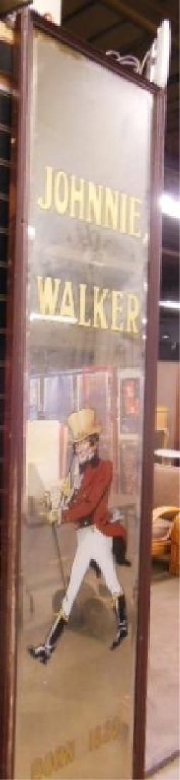 1930s-1940s Johnnie Walker Advertising Mirror: Framed circa 1930s-1940's Johnnie Walker Scotch Whiskey 95" (h) x 17" (l) advertising mirror, 97" (h) x 20" (l) over all size framed. CONDITION: Mirror is in very good condition with minor wear. Frame