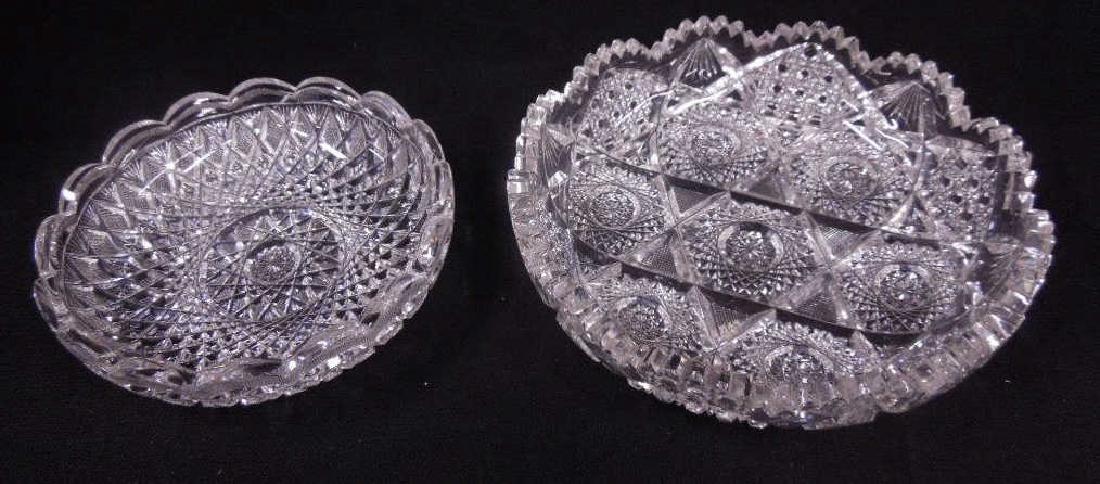 Two American Cut Glass Shallow Bowls: Early 20th C. American cut glass shallow bowls, Taylor Bros. signed 2" (h) x 7" (l) and unsigned 2 1/2" (h) x 8 1/2" (l). CONDITION: Both have areas with small chips with-in their patterns. Unsigned h
