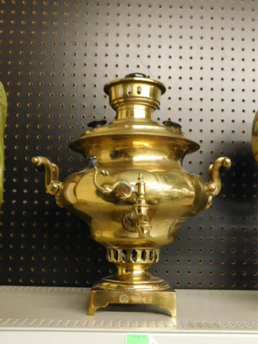 Russian Brass Samovar: Russian Brass Samovar, in squat paneled form with fixed ebonized wood handles, 1870 and other touch marks on top and base, later fitting for electricity, 16 1/2"h, 14"d. CONDITION: Areas of finish wea