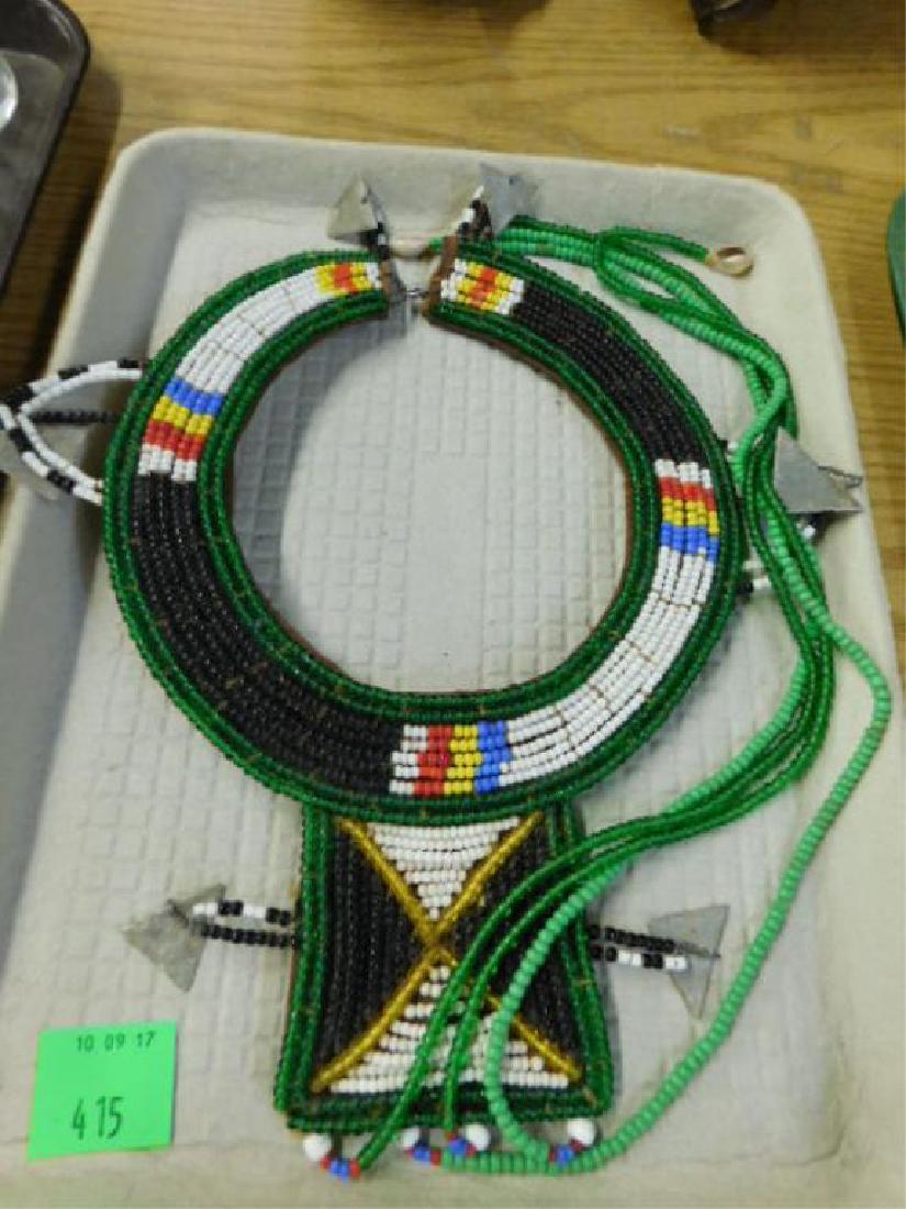 African Maasai Collar Necklace: Vintage African Maasai tribe 29"L glass bead collar necklace with courie shell & metal mounts. CONDITION: Areas with wear from usage.