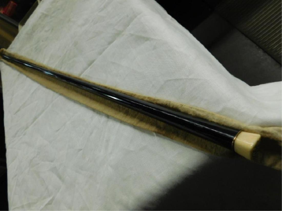 Antique Ebonized Wood Walking Stick: Antique Ebonized Wood Walking Stick, late 19th / early 20th C. bone head and ebonized wood 35 1/2" (l) comes with its original cloth holder, DMS monogramed initials etched into top of bone head. CONDI
