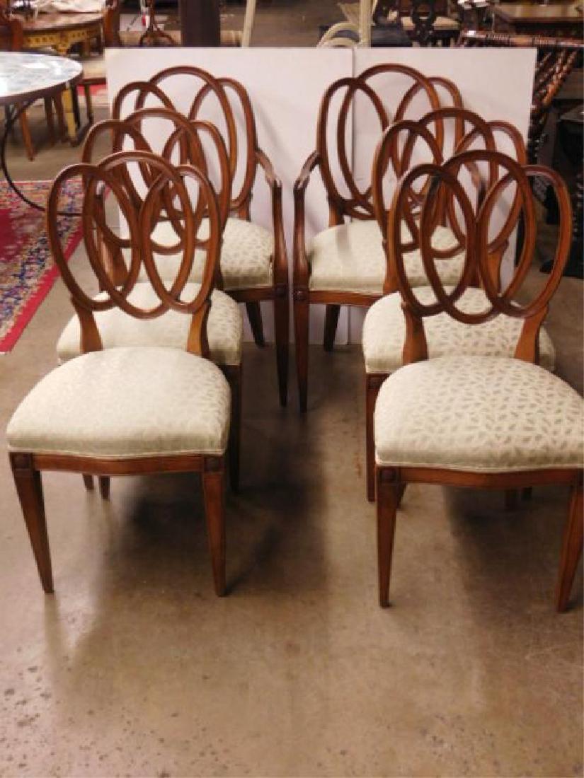 Set of 6 Pretzel Back Chairs: Set of six Pretzel Back Chairs,mahogany, upholstered serpentine front seats with blocks and rosettes above the tapered square legs, early 20th C. CONDITION: Old repairs on four backs and one arm.