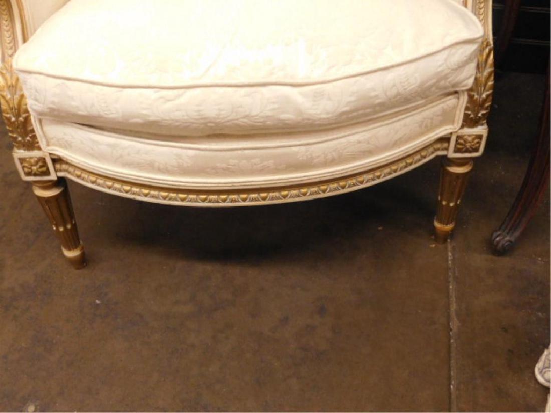 Louis XVI Style Club Chair: Louis XVI Style Club Chair, antiqued white and gilt carved wood frame with bead, foliate and acanthus carvings, reeded turned legs, ivory brocade upholstery, early 20th C. 29 3/4' h. CONDITION: Areas